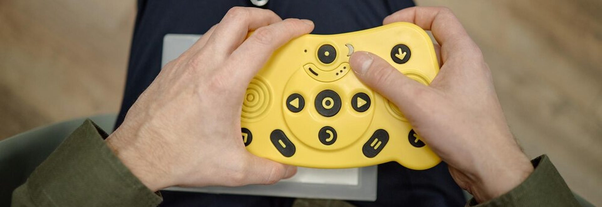 Steam Deck held in one hand showing trackpad usage