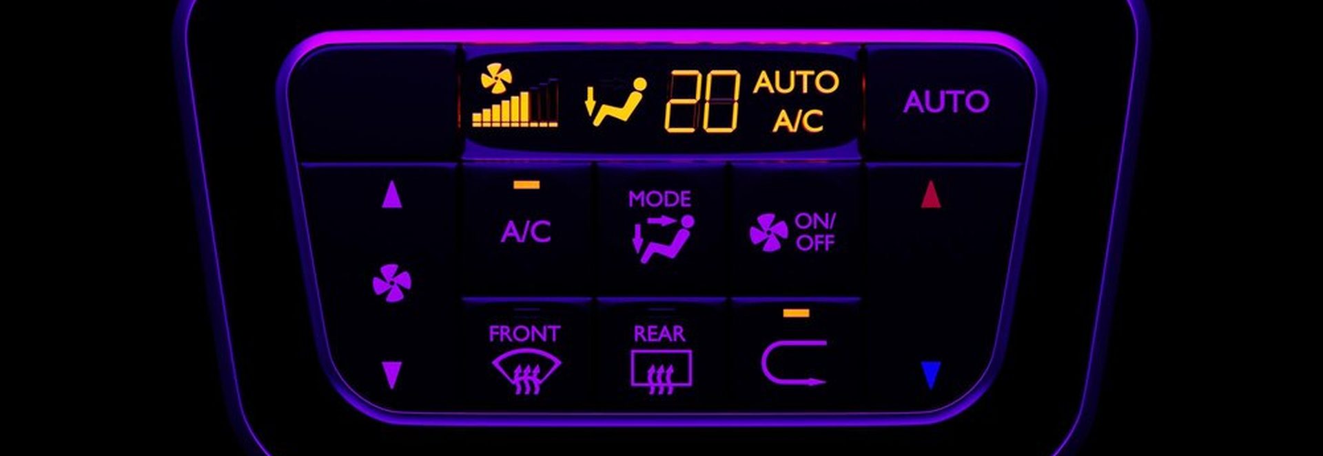 Steam Deck OLED charging in a car glovebox with USB-C cable