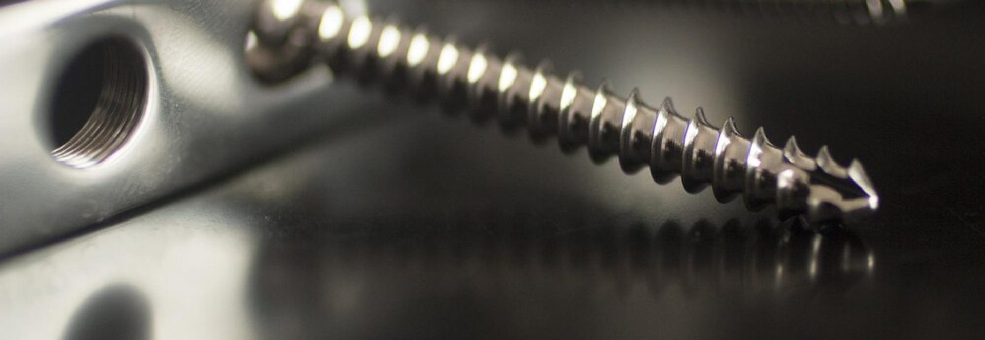 Close up of a stripped screw on a Steam Deck back cover